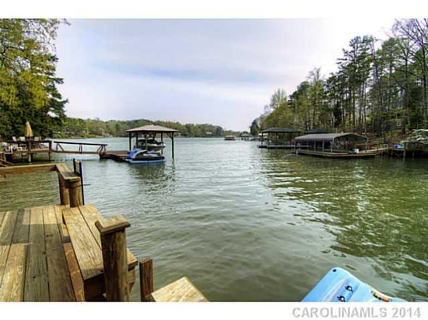 Spacious waterfront home, deep water lot, quiet cove with beautiful views! Beautiful curb appeal, large living spaces, multiple decks, unfinished basement, loads of storage. Vacation living every day! Tega Cay amenities, Fort Mill schools.