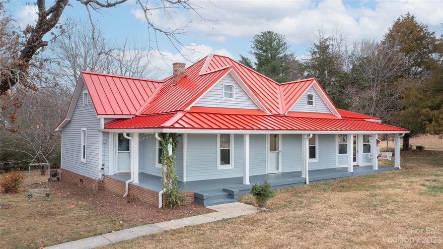 Farm Living at its finest! This "homeplace" is situated on 8.67+/- acres, fenced pasture area, barn with tack room and 2 stalls, studio guest house, 2 car garage with storage, treehouse and chicken condo coup! This property is convenient to downtown Morganton and I-40. The barn was hand-built by the original owners. You can still see the hatchet marks on the hand hewn long beams in the stalls. Inside this unique property you'll find all the modern conveniences while still keeping the rustic, farmhouse feel.  A gourmet kitchen was added in 2020, with Wolf gas range, slate flooring, backsplash and granite countertops.  Additional storage was added to the Kitchen with ceiling height cabinetry and a fun red ladder! The studio guest house (original granary)was remodeled in 2019 and offers many income producing opportunities.  So much history!
