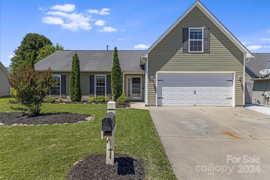 Welcome to this beautifully updated, open-concept home featuring a meticulously maintained interior and exterior. Step into a spacious living area with a tiled fireplace and open concept. The modern kitchen boasts updated cabinets, a new sink, stunning granite countertops, a stylish backsplash, and a large island complemented by newer appliances and luxury vinyl plank floors. Each bedroom is equipped with ceiling fans for added comfort. The smaller bathroom features a new vanity, while the garage includes a 220v circuit, perfect for an electric vehicle. Outside, enjoy a fenced backyard with a large stamped patio, ideal for entertaining and wired for indoor/outdoor speakers. The home also offers an extended parking area and is within walking distance to the neighborhood pool, playground, and picnic area, with the added charm of weekly food trucks. This home is a perfect blend of style, convenience, and community.  Check out the 3D Matterport Tour: https://bit.ly/335WSwift3D