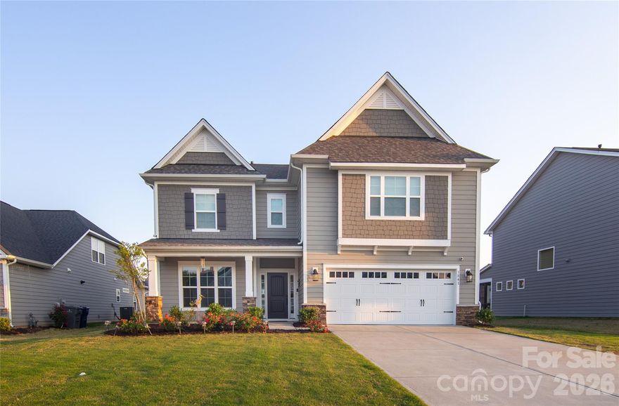 Welcome to this beautifully appointed 5-bedroom, 4-bathroom single-family home in the heart of Harrisburg, where comfort, style, and convenience come together seamlessly. Designed with both everyday living and entertaining in mind, the open floor plan showcases a stunning kitchen featuring quartz countertops, a gas cooktop with a hood, double wall ovens, elegant backsplash, upgraded fixtures, and a spacious separate pantry.

The inviting living room is anchored by a cozy fireplace and enhanced with custom built-in shelving, creating a warm and functional gathering space. Step outside to enjoy a covered porch overlooking a flat backyard—perfect for relaxing evenings or outdoor entertaining.

The luxurious primary suite offers a true retreat, complete with dual vanities, a garden tub, a walk-in shower, and a generous walk-in closet. Upstairs, three additional bedrooms are thoughtfully arranged with access to two full bathrooms, providing comfort and flexibility for family or guests. The loft is currently being used as Media space and can be used for any other purpose. 

Ideally located, this home offers exceptional access to shopping, dining, Harrisburg Park, and the new Harrisburg YMCA. Directly across from the community is Stallings Road Park that has a playground, picnic shelter & walking trail, plus ball fields & tennis courts.. The neighborhood is also surrounded by highly sought-after Harrisburg schools, with convenient proximity to elementary, middle, and high schools, as well as scenic walking trails throughout the community.