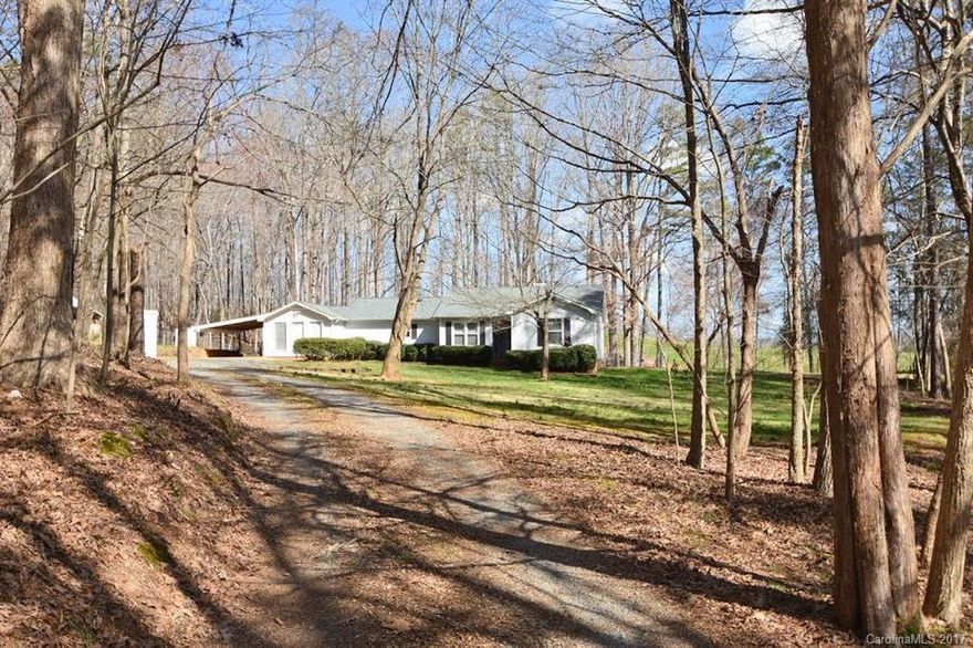Beautiful setting on over 3 Acres of wooded privacy sits this incredible find! 100% updated 4 Bedroom, 3.5 bath ranch.  Stunning new updates include all NEW Kitchen w/custom cabinets, granite counters & S.S appliances! New engineered hardwood floors, carpet & updated bathrooms! Ceiling fans in all bedrooms, newer hvac system, roof & large fenced backyard.  Over sized wired workshop & 2 car carport. Upgraded low maintenance vinyl siding. ONE OF A KIND PROPERTY! PRICED FOR QUICK SALE! HURRY!