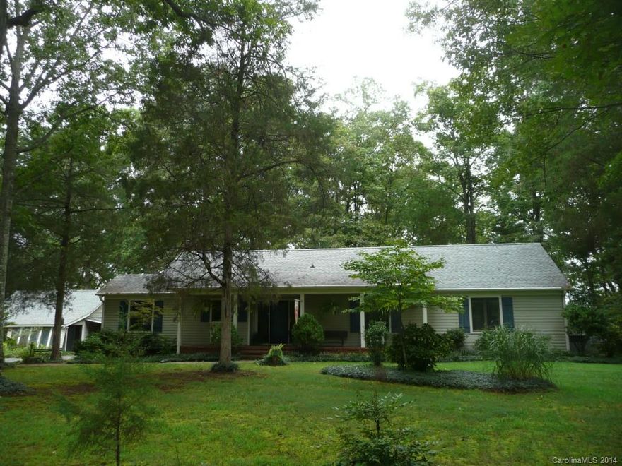 This custom blt home is sitting on 9-acre parcel offering privacy & style & 5 mins.to new Charlotte Outlet Mall.You will love the spaciousness & open feel to the GR/DR/kitchen of this home w/beautiful brick wall/FP area.The oversized master suite is outstanding.Wrap-around,rocking chair porch adds charm & country feel to this outstanding property. Attention investors:Home parcel has 6 acres & addt'l parcel has 3.39 acres.You will be impressed when you see what this home & property have to offer.