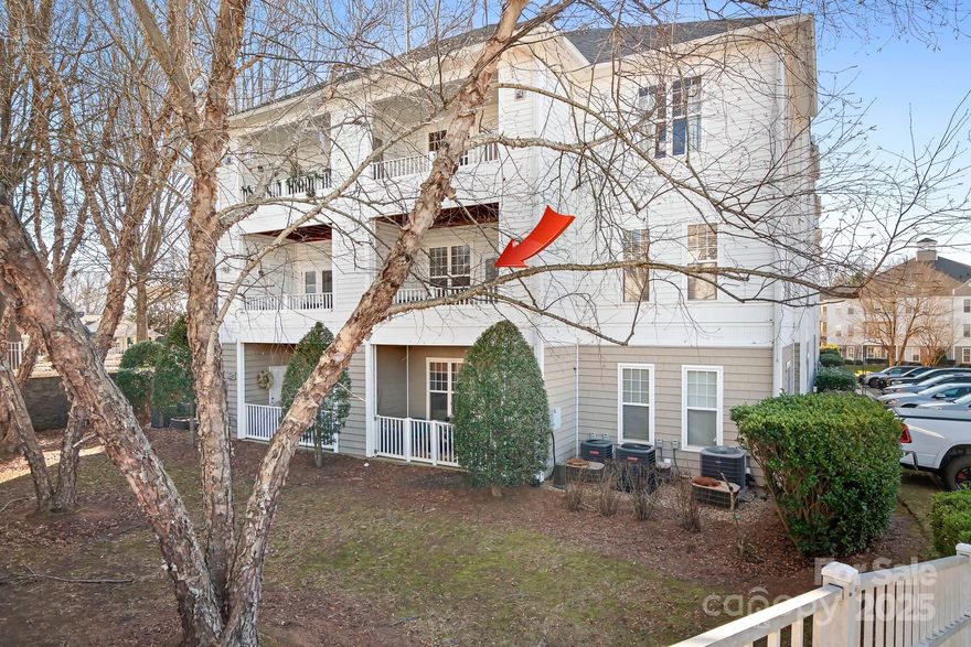 Attractive second floor condo ideally located in the heart of all the action. You will love its walkability to nearby restaurants. This building offers both elevator and stair access for added convenience. Updated kitchen with granite, white cabinetry, and a custom backsplash, fireplace, low maintenance flooring in the main living areas, faux wood blinds, tall 9 1/2 ft ceilings throughout, and carpet in bedrooms make this the ideal unit for everyday livability.  Open concept layout seamlessly connects the kitchen, dining, and living spaces, creating an inviting atmosphere. Kitchen is equipped with a microwave, dishwasher, and oven, with convenient access to the laundry area. Spacious primary bedroom includes a large en suite bathroom, window seating, and generous closet space. The second bedroom, positioned on the corner of the building, is filled with abundant natural light and easy access to the hall bath, making it ideal for guests, a home office, or additional living space. Outside you will enjoy views of the common area from the shaded balcony, perfect for relaxing outdoors. Community amenities include greenways, swimming pool, sports court, and a playground. That's not all, don't forget to take advantage of the close proximity to live entertainment venues, lake access, and outdoor recreation. The new hospital is nearby. Easy access to Huntersville, Cornelius, Mooresville & Charlotte. Don’t miss the opportunity to own this updated condo in an unbeatable location.