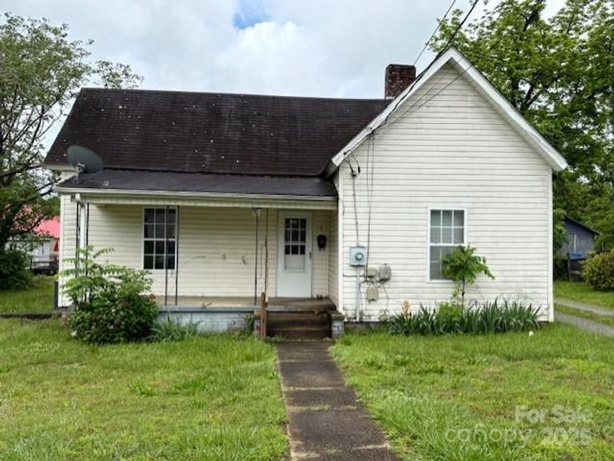 Great location located in the city limits of Morganton, walking distance to downtown.  With off-street parking and close proximity to schools, shopping, restaurants, and public transportation, this home is ideal for first-time buyers, down-sizers, fixer uppers, or and investment property.  The kitchen provides functional workspace and connects easily to the dining and living areas, creating an open and efficient flow. Both bedrooms are well-proportioned, and the single full bathroom is centrally located for convenience.
Outside, the property features a manageable yard—ideal for gardening or simply enjoying a bit of outdoor space within the city.