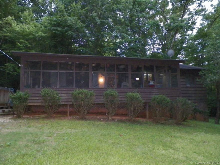 Rustic, 2BR, 2BA  home with full basement!  VERY PRIVATE!  End of street location at the water's edge!  Easy walk; gentle slop to the Lake, bank fishing!  Approx. 357' of shoreline...  NO PIER OR BOATHOUSE PERMITTED PER CUBE HYDRO CAROLINA!  Approx. 1400 HSF main level; approx. 900 HSF in the basement; approx. 500 SF additional unfinished basement area. Front porch/Sunroom.   Needs some LOVE AND TLC!  Sound, but deferred maintenance; sold 'AS-IS"... Lots of potential, priced under $200K!