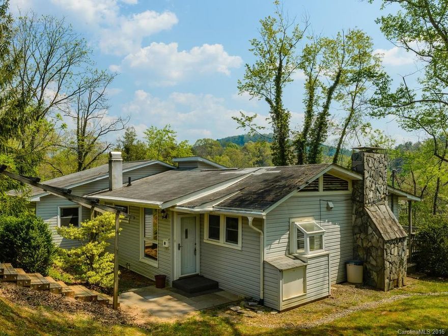 Fabulous updated home in the convenient Riceville Rd area! You will love all the finishes including the granite counters and cork flooring in the kitchen, as well as the beautiful refinished hardwood floors. Enjoy the views from all the windows in the living room or the spacious deck. Plus large finished space downstairs is ready for just about any purpose imaginable. Close drive to East Asheville, Tunnel Rd, the parkway, or to the interstate. You will want to come see this home while it lasts!