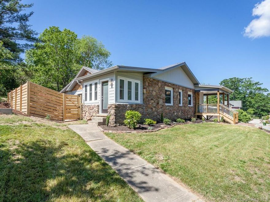1920s Bungalow charm w/ modern conveniences. Light-filled renovation offers 1-lvl living & open floorplan. Vaulted ceilings & custom features throughout. Thoughtful layout provides excellent flow from inside to outside living areas; large yard w/patio, firepit & hardscaping, side porch off dining area w/ private courtyard. Home sits up and off st w/ winter views from covered front wrap around porch w/ off st parking & main lvl access from back of home. HUGE 1/4 acre lot for West AVL!