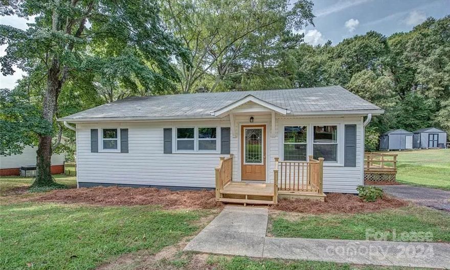 Charming 1960's bungalow in the heart of Belmont. This lovely home on large lot across from Page Elementary School. Beautifully refinished original hard wood floors throughout. Kitchen has updated white shaker cabinets with subway tile backsplash. Stackable washer/ Dryer included with rental. Three gracious bedrooms and updated common hall bathroom. Home has newer gas furnace and upgraded electrical throughout. Don't miss out on this charming cottage. Pets are conditional.