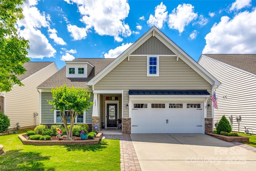 Welcome home to this meticulously maintained 3-bedroom, 2.5-bath ranch in Carolina Reserve. This open floor plan home showcases a beautiful kitchen with an expansive island, abundant cabinetry, a breakfast area, and a formal dining room. The great room features a gorgeous stone gas fireplace, creating a warm and inviting space for gatherings. The spacious primary suite offers a private retreat, complete with a sitting area and direct access to the screened porch. The updated en-suite boasts dual vanities, a walk-in shower with built-in bench, and a generous walk-in closet. Two additional bedrooms provide flexible space for guests, an office, or hobbies, and are served by a separate, updated full bath. Outdoor living is a dream with a screened porch, an extended paver patio, a pergola with bar area, a built-in grill, and a fenced backyard—perfect for enjoying the Carolina sunshine. HOA includes lawn maintenance, trash and recycling pickup, and access to neighborhood amenities.