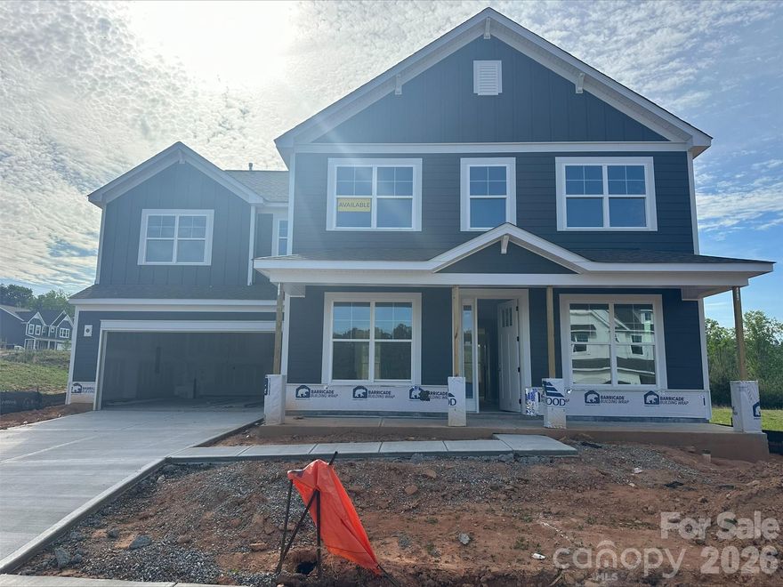 Brand new construction in an amenity-rich community less than two miles from Lake Norman. Live the "suite" life in this Colfax plan! The home offers ensuite bathrooms in the guest bedroom on the main, and the primary suite plus another secondary bedroom upstairs. Plenty of options for everyone with a total of 5 bedrooms, 4.5 baths, and more than 3,600 square feet of living space. The kitchen features a stainless range hood along with white cabinets, quartz counters, tile backsplash, gas cooktop and wall oven & microwave. The butler pantry also has upper and lower white cabinets and a tile backsplash. The main floor also includes a family room with gas fireplace, dining room with tray ceiling, and an office with French doors. The upper floor has 9-foot ceilings and has the primary suite with luxury bath, three secondary bedrooms (one with an ensuite bath), a loft, and laundry room. The rear of the home features a covered porch along with a paver patio, firepit & seating wall. Other wonderful extras include a foyer with tray ceiling, stairs with composite treads & metal balusters, and Craftsman-style wood trim. Community amenities include a pool, clubhouse, pickleball courts, and pocket parks!