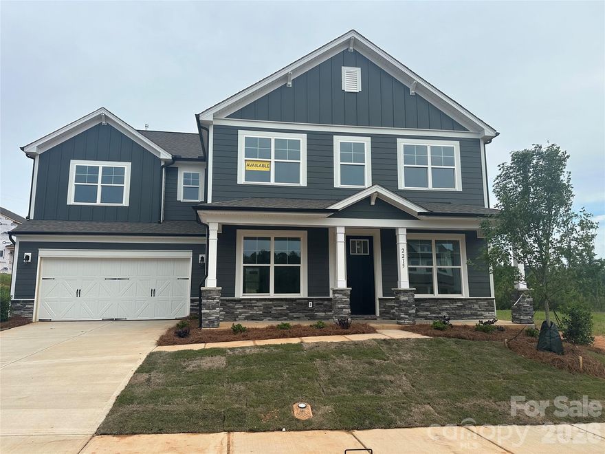 Brand new construction in an amenity-rich community less than two miles from Lake Norman. Live the "suite" life in this Colfax plan! The home offers ensuite bathrooms in the guest bedroom on the main, and the primary suite plus another secondary bedroom upstairs. Plenty of options for everyone with a total of 5 bedrooms, 4.5 baths, and more than 3,600 square feet of living space. The kitchen features a stainless range hood along with white cabinets, quartz counters, tile backsplash, gas cooktop and wall oven & microwave. The butler pantry also has upper and lower white cabinets and a tile backsplash. The main floor also includes a family room with gas fireplace, dining room with tray ceiling, and an office with French doors. The upper floor has 9-foot ceilings and has the primary suite with luxury bath, three secondary bedrooms (one with an ensuite bath), a loft, and laundry room. The rear of the home features a covered porch along with a paver patio, firepit & seating wall. Other wonderful extras include a foyer with tray ceiling, stairs with composite treads & metal balusters, and Craftsman-style wood trim. Community amenities include a pool, clubhouse, pickleball courts, and pocket parks!
