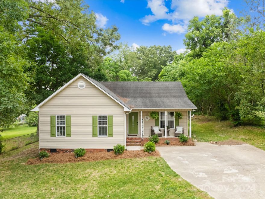 Say hello to this charming well maintained ranch style home situated on a little under an acre. This home features open floor concept with lots of natural light throughout. Cozy up to the fireplace as you take in the beautiful vaulted ceilings. The kitchen features stainless steel appliances and ample cabinet and counter space. The primary bedroom has a full ensuite, spacious walk in closet, and split floor plan for added privacy. Enjoy the spacious deck in your private backyard. Perfect for those fall/summer Carolina evenings.