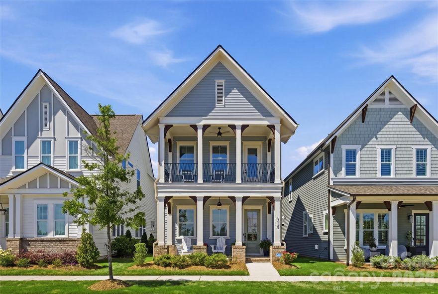 Welcome to 713 Barrel Alley in Fort Mill, South Carolina, a newly constructed residence built in 2024 by Saussy Burbank that reflects classic Southern design with Arts and Crafts influence. Framed by double-decker covered porches, the home presents a balanced approach to architecture and livability, where outdoor spaces are as intentional as the interiors. A covered front porch introduces a welcoming foyer, setting a composed and inviting entry point. Just beyond, a dedicated dining room offers a defined space for gatherings, positioned to support both everyday living and more formal occasions. The main living area unfolds with continuity, featuring luxury vinyl plank flooring, coffered ceilings, a ceiling fan, and a gas fireplace that anchors the room. A thoughtfully placed drop zone provides a functional transition to the rear of the home. The kitchen is designed with both utility and refinement in mind, complete with quartz countertops, a farmhouse sink, a gas oven and cooktop, and extensive cabinetry. A walk-in pantry or butler’s pantry enhances the space with custom shelving and a designated coffee station, supporting both storage and daily routines. Upstairs, the primary suite is filled with natural light and offers direct access to a covered porch, creating a private extension of the living space. The en-suite bath includes a dual-sink vanity, zero-entry shower, and a walk-in closet with custom shelving, designed for both comfort and organization. Two additional bedrooms are well-proportioned, each offering ample natural light and flexible use. The outdoor setting continues with an enclosed backyard and a covered rear patio, complemented by a two-car rear-load garage. Each element of the home reflects a cohesive approach to design, function, and Southern architectural character. Showings begin April 25. Schedule your private tour to experience the design, layout, and outdoor living this residence offers.