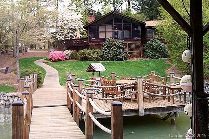 Wonderful Waterfront rental - fully furnished except linens.  Linens can be provided for an additional fee.  Currently in a Vacation Rental Program - Available Date is subject to change.  Vaulted ceilings in Great Room and all bedrooms.  Sq.Ft. does not include huge screened porch overlooking the lake - Perfect for sunrises.  Two King beds and two twin beds.  Large flat screen TV in Great room, smaller one in the master.  All utilities are included in pricing. Wood burning fireplace