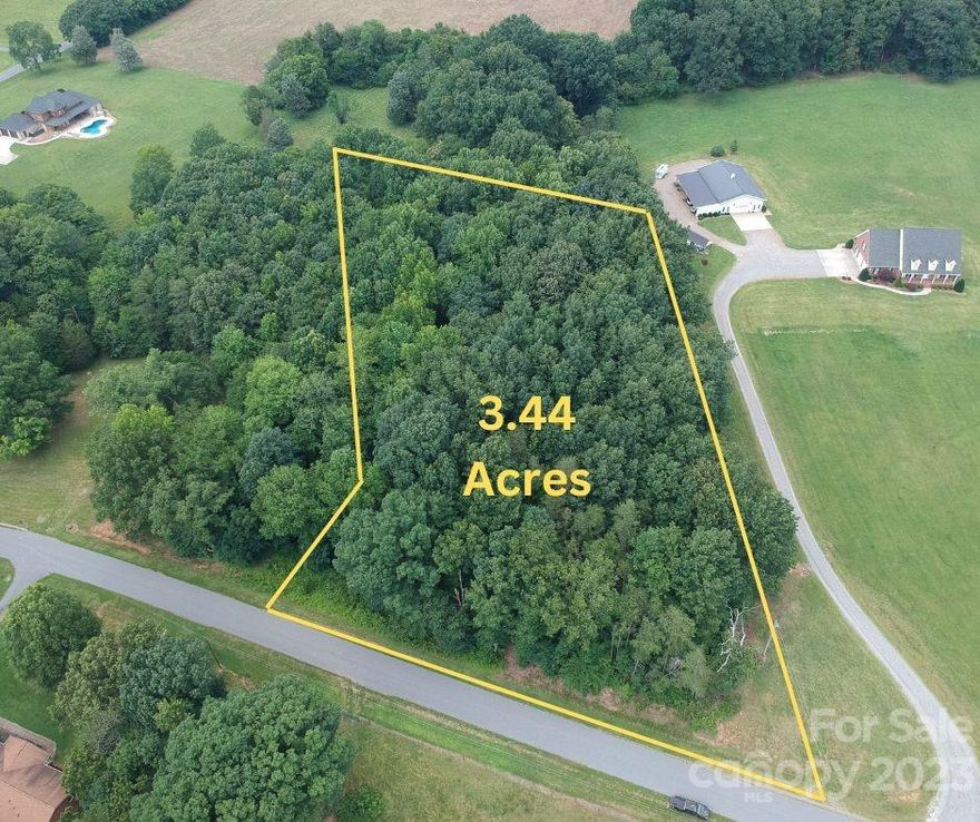 This 3.44 acre lot which is nestled into the country side is begging for someone to come along and build their dream home. With farm land views and little to no traffic noise, the location is perfect for someone looking to enjoy their privacy. The land sits 9 miles away from downtown Statesville and 49 miles away from uptown Charlotte. Don't miss your opportunity to be able to call this small country side neighborhood HOME.