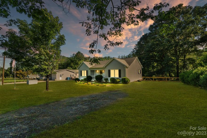 MULTIPLE OFFERS RECEIVED!  Highest and best offers due by Monday 8.13.23 at 5:00 pm. Gorgeous ranch in Hickory! This 2 bedroom, 1 bath home features wood laminate flooring throughout, gorgeous french doors leading to the back deck, and an open concept floor plan - great for entertaining! The kitchen is light, bright, and features dining area, granite-like counters, and matching stainless steel appliance package - any chef's dream! Nestled amongst trees, enjoy privacy relaxing in the oversized backyard with raised garden beds. Conveniently located, enjoy ease of access to Lake Hickory as well as local shopping, restaurants, and more! This one won't last!