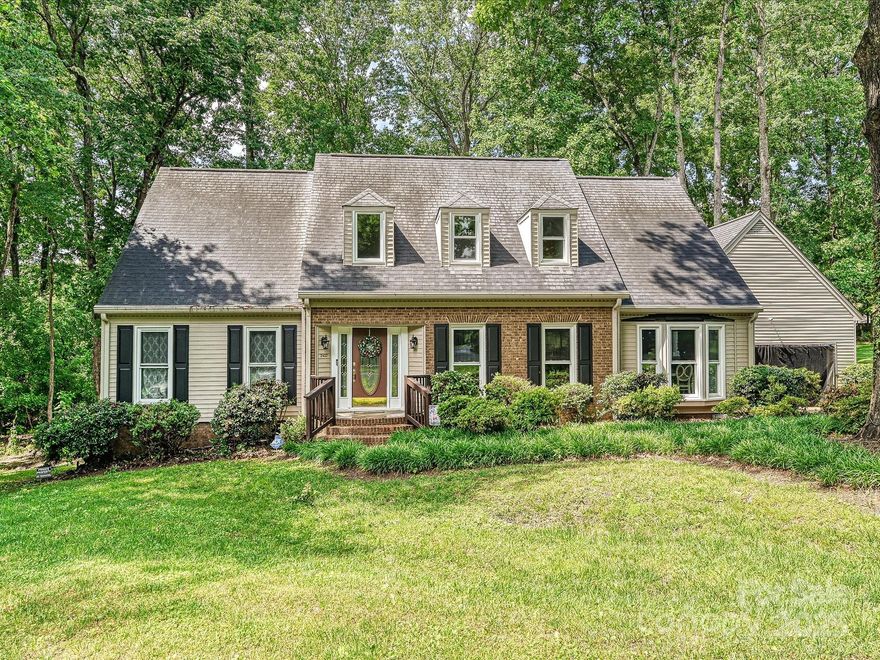 Set on over an acre in the charming Woodleigh neighborhood, this ideally located 4-bed, 2.5-bath home offers comfort, space, and modern upgrades along with expansive outdoor spaces. Since 2022, the owners have added new windows, fenced part of the yard, remodeled the garage with a mini-split, and finished the room above it with added stair access. The updated kitchen features stainless steel appliances and tile floors along with tasteful modern cabinets and tops. Enjoy new carpet in all bedrooms, a new water heater & septic pump plus a new fire pit beside the creek— all updated since 2022. You'll love the creekside area perfect for relaxing, entertaining, or just enjoying nature. All of this, tucked away in a classic neighborhood with a mature tree canopy, room to breathe between neighbors and a Little Free Library right across the street! Located off of Gaston Day School Rd, just minutes to the best of Gastonia! The 270 Additional square feet is for the finished room above the garage.