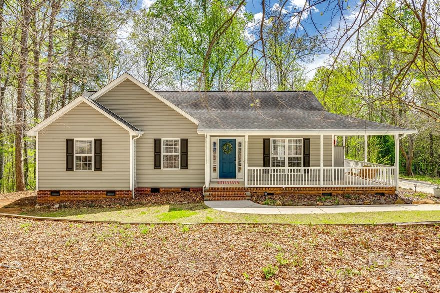 Nestled in a tranquil setting, this charming 3-bedroom, 2-full bath home offers a perfect blend of comfort and privacy. Step inside to discover a cozy family room featuring a welcoming fireplace, ideal for cozy gatherings during cool evenings. The kitchen is equipped with stainless steel appliances, while the primary bedroom boasts a relaxing garden tub for your indulgence. Throughout the home, ceiling fans provide added comfort, and the beautiful wrap-around porch is an inviting spot to unwind. The fenced backyard backs to a wooded area, ensuring privacy and a peaceful retreat. With no homeowner association fees, enjoy the freedom of homeownership, and take advantage of the home's convenient location just minutes away from hospitals, restaurants, grocery stores, and gyms. This home presents an ideal sanctuary for peaceful living with modern conveniences.