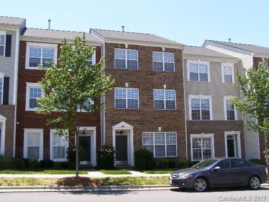 Right where you want to be! Walk out to shopping, dining, movies, exercise facilities! Hop on the interstate.  So convenient! Enter on the ground floor of this spacious town home to a  Den w/half bath. (also makes a great home office) Wonderful open entertaining space on 2nd level w/ formal Living/Dining area + Kitchen/ Family Rm w/FP. Breakfast Nook has sliders to large rear deck. 2nd Half Bath on this level. 3rd level has vaulted Master w/private bath, 2 BRs & 2nd full bath. Two car garage.