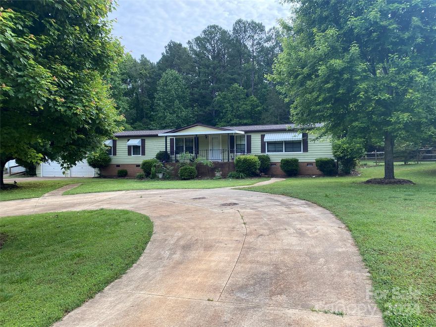 Back on the market with a new roof and new skylights.  Own a piece of Heaven in North Iredell. This is a rare find needs nothing and is nestled in the Cool Springs Community. This area is a great place to live and has a wonderful school district. Close to interstate 77, yet located in the country.  This ranch style house sits on a level 1.738 acres of land with a fenced back yard for all flurry friends and a large open area in the front and back yard to enjoy.  Also, this property has a he and she shed or outbuilding and a lawn mower garage building. This house has an inviting front porch and large wood rear porch, and a rear enclosed or sun porch for all your outdoor entertaining. The interior features an open floor plan with a living room and a den with a fireplace. This is a one-of-a-kind property.  There are no repairs needed that owner is aware of. The seller is selling as is. Will not last long.