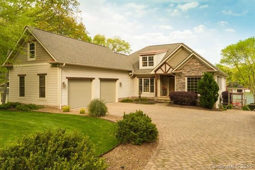 Stunning Waterfront Home Just off Main Channel with 2nd Living Quarters!Open Floor Plan with Gourmet Kitchen, Great Room with Double Sided Fireplace, Lower Level has Full Custom Kitchen,Great Room, Lower level Room Currently Being Used as 4TH BEDROOM,Full Spa Like Bath,2nd Laundry,Heated/Cooled Workshop. Extensive Landscaping, Main Level Covered Deck with Surround Sound & Outdoor Fireplace, Lower Level Covered Patio with Walk Out Access,NO HOA! Extensive Pier with Covered Sitting Area/Boat Slip!