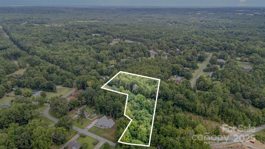 Don’t miss this hard-to-find 1.57-acre parcel in the heart of Fort Mill, tucked away in a quiet setting yet just minutes from everything. Located in a top-rated school district and surrounded by established homes, this land offers the perfect spot to build. The lot has already passed a perc test and is ready for your vision—whether you’re looking for privacy, space to spread out, or future potential. No HOA. Great location, great schools, and a rare opportunity in one of the area's most desirable communities!