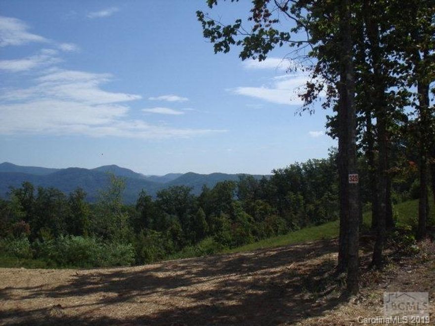 Gently sloping wooded lot in gated community of Grandview Peaks in the South Mountains. Mountain and wooded views. Will require septic and well.  This community offers paved roads, underground utilities, a community lake for swimming and kayaking. It is just 35 minutes from Asheville, close to Marion and Morganton, one hour from Charlotte.