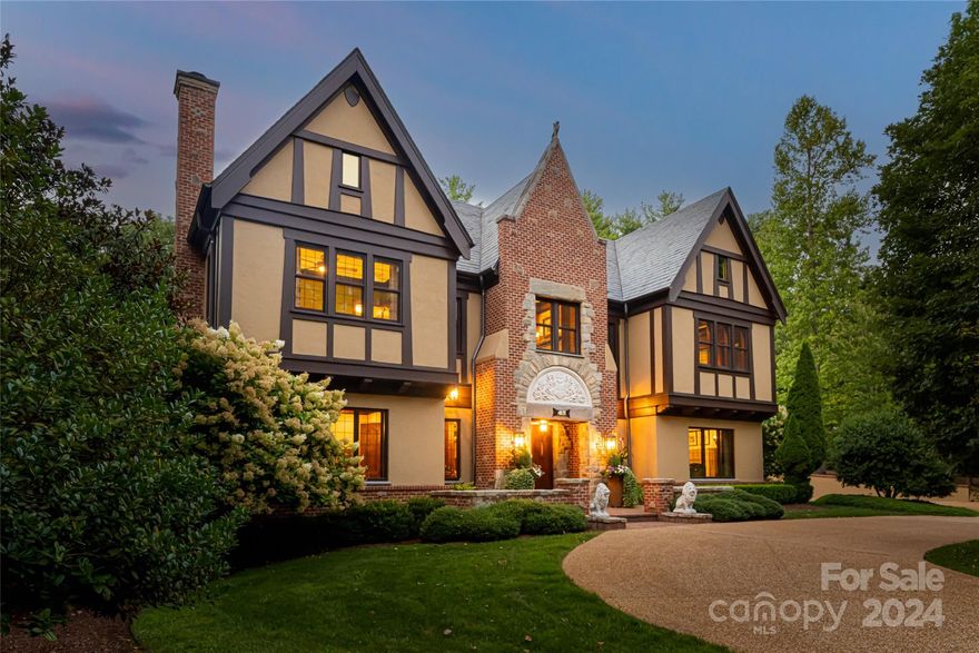 Experience extraordinary living in this thoughtfully designed custom European Tudor. Entering the home you will find Formal Library and dining with tasteful built in's. The open greatroom flows into the kitchen and hearthroom, creating a warm, inviting atmosphere in sheer sophistication.The primary suite opens to a walled secret garden, ideal for relaxation. Multiple terraces offer spaces for both entertainment and tranquility. The walk-out basement is perfect for entertaining, with a media room, wine cellar,  wet bar area, and great room that opens to a lower side yard with a wall fountain. The beautifully landscaped backyard features a fountain and gardens, providing a serene retreat. Incredible second living quarters cater to family or staff needs. Situated on an estate lot within a guarded and gated community, this home offers access to parks, trails, a wellness center, and a saline pool. Discover exceptional daily living, elegance, and comfort in this unique home.