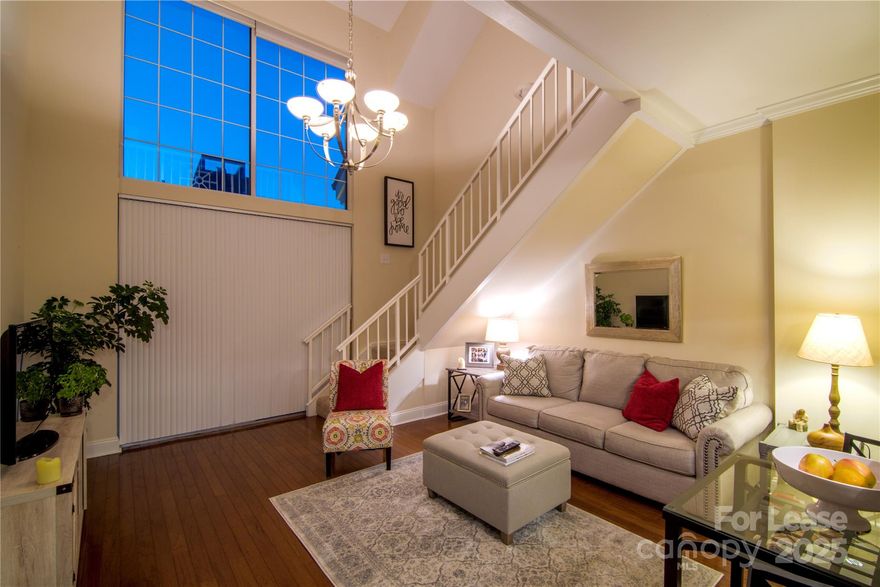 This RARE BI-LEVEL CONDO is one of just 15 in the building, offering a unique blend of space, privacy & versatility. The well-appointed kitchen features upgraded cabinetry, granite counters & stainless steel appliances. A soaring vaulted ceiling enhances the great room, which opens to the private balcony...ideal for enjoying morning coffee or evening cocktails! A guest suite w/full bath completes the main floor. An elegant turned staircase leads to the open loft, highlighted by a custom built-in bar-a perfect home office or additional living space-and the primary bedroom  w/ensuite bath & a generous walk-in closet, provides a peaceful retreat. 
Enjoy resort-style living with unparalleled amenities: 24/7 concierge, business center, coffee bar, media lounge, indoor & outdoor fireside lounges, newly expanded fitness center, pool, gazebo bar, putting green, pet park—even an ON-SITE Harris Teeter! Secured parking, of course. The ultimate in luxury & convenience awaits your arrival!