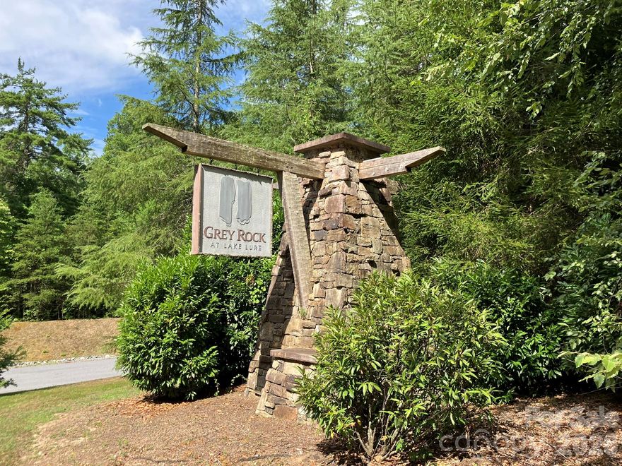 Build your mountain getaway in Grey Rock at Lake Lure. Lot 225 offers a private, wooded setting within a gated community nestled in the foothills of the Blue Ridge Mountains, known for its natural beauty and peaceful surroundings.

The $15,000 electric assessment is to be paid by the buyer at closing, contributing toward utility infrastructure within the community. The lot is ready for your vision (well and septic required). Grey Rock maintains paved roads throughout the community and a minimum 1,800 square foot build requirement, supporting quality construction and accessibility. Whether you're planning a full-time home or a second residence, this property provides flexibility in a desirable location.

Grey Rock is known for its quiet atmosphere, abundant wildlife, and well-maintained surroundings—ideal for those seeking a full-time residence or a mountain retreat. Residents enjoy convenient access to the Lake Lure area, including boating, fishing, kayaking, and the public beach.

Nearby Chimney Rock State Park offers hiking trails, rock climbing, and long-range views of Hickory Nut Gorge. Additional area attractions include golf courses, equestrian facilities, and outdoor recreation throughout the region.

If you’ve been waiting for the right combination of location, setting, and value—this homesite is worth a closer look.

Additional community information available at www.greyrocktoday.com