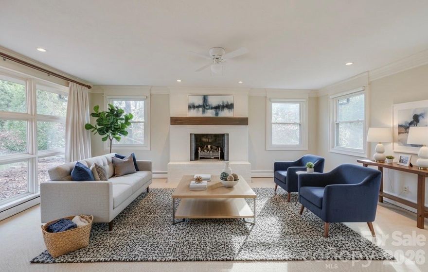 New Price! Beautiful Mid Century Modern home in well established Riverside area with 2025 UPDATES! Inviting Living Room boasts gas fireplace on main level with dining and eat in kitchen. 3 bedrooms on the main with a 4th or Office in the lower level. 3 full baths. Spacious daylight basement family room with gas fireplace, kitchenette and dining area. Updated basement with LVP Flooring, new carpet, trim, crown molding, new doors, and new lighting. Gas Bosch boiler installed 2023, Garage Door and system installed 2023, Dishwasher and disposal installed 2024, Ceiling fans installed 2024, Steel Door from laundry to garage installed 2025. Deck boards replaced in 2025. Adorable play space/pet space under the stairs. Fantastic lawn with gentle slope.  In town living yet tucked away so you don't feel you have participate when you need some down time on the deck!  Sunroom off Main Level Primary Bedroom. Desirable well maintained area. Walk to Downtown Morganton, or walk the Greenway. Close to I-40 and UNC Health Blue Ridge Hospital. Great Location!