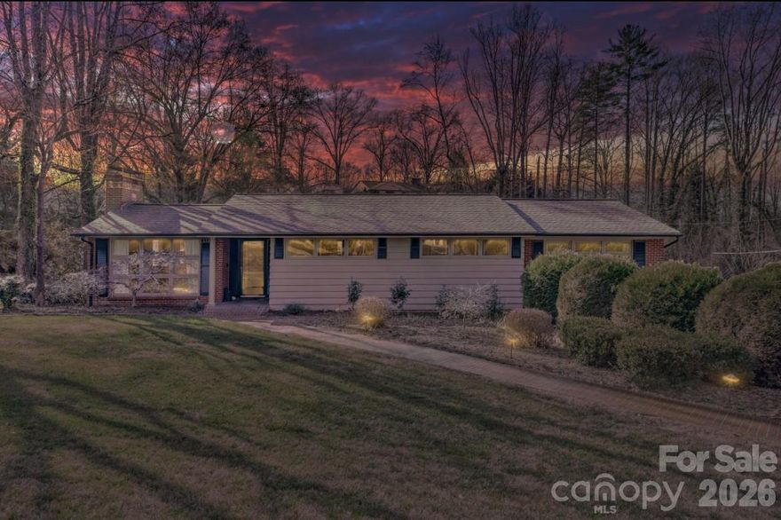 New Price! Beautiful Mid Century Modern home in well established Riverside area with 2025 UPDATES! Inviting Living Room boasts gas fireplace on main level with dining and eat in kitchen. 3 bedrooms on the main with a 4th or Office in the lower level. 3 full baths. Spacious daylight basement family room with gas fireplace, kitchenette and dining area. Updated basement with LVP Flooring, new carpet, trim, crown molding, new doors, and new lighting. Gas Bosch boiler installed 2023, Garage Door and system installed 2023, Dishwasher and disposal installed 2024, Ceiling fans installed 2024, Steel Door from laundry to garage installed 2025. Deck boards replaced in 2025. Adorable play space/pet space under the stairs. Fantastic lawn with gentle slope.  In town living yet tucked away so you don't feel you have participate when you need some down time on the deck!  Sunroom off Main Level Primary Bedroom. Desirable well maintained area. Walk to Downtown Morganton, or walk the Greenway. Close to I-40 and UNC Health Blue Ridge Hospital. Great Location!