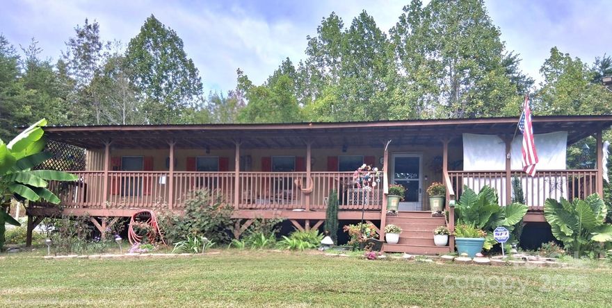 Charming 2BR/1BA country retreat on a private, tree-lined lot. Thoughtfully updated with a new metal roof, updated kitchen cabinetry, and fresh flooring throughout. Nearly 700 sq ft of efficient, low-maintenance living with a functional split-bedroom layout. Enjoy homestead-ready features including a fully fenced yard, raised garden beds, custom dog lots, multiple storage sheds, and a spacious new back deck. Ideal for full-time living, weekend escape, or a simple rural lifestyle. Quiet, private, and move-in ready.