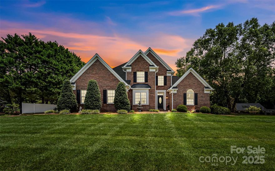 Stunning brick 4BR/2.5BA home in the Rainbow Hills subdivision, primary bedroom on the main level, situated on over a quiet acre with an in-ground pool, and pool house! Beautifully landscaped, this immaculate home has IT ALL! Main level offers beautiful hardwoods & cathedral ceilings in living room. Living room is spacious w/ fireplace & large windows. Open floor plan flows into the kitchen, w/ granite countertops, eat-in area, pantry & views into the backyard. Large laundry room on main. Spacious formal dining room, perfect for entertaining. Large primary bedroom w/ walk-in closet filled with built-in shelving. Primary bath offers double vanities, linen closet, soaking tub, shower. Second floor offers three large bedrooms with ample storage space. The large back patio opens onto the in-ground pool area, complete with pool house & exterior storage area! Huge backyard surrounded by mature trees. The perfect setting! Blackburn, Jacobs Fork, Foard school district. No city taxes!