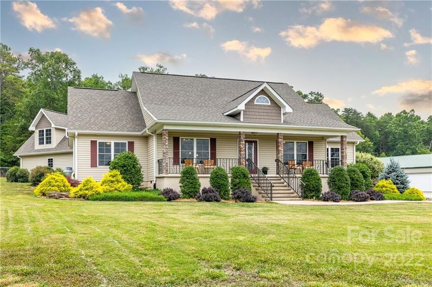 Think Ready to Ride - Move in and saddle up!  Enjoy riding in the brand-new Fleet Fiber footing arena or on the inviting neighborhood trail.  And when you are finished, relax in this like new home with open, and split bedroom floorplan, perfect for everyday living and entertaining. The main floor features include combined great room/dining room/kitchen with vaulted ceilings and laminate wood floors, a large entry with sitting room, and office. The main-floor primary bedroom has a luxury bathroom with double sink vanity, separate shower, and a soaking tub, perfect after hours in the saddle. The guest spaces include a main floor bedroom and bath, and an upper-level bedroom and bath with attached family room. Enjoy evenings on the covered front porch with views of the pastures and entertain friends on the covered back porch and flagstone patio. The 6-stall barn has a large apartment, tack/feed room, wash rack, and large workshop.