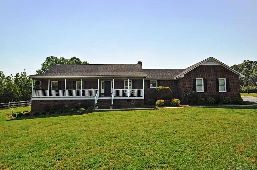 Beautifully updated ranch on a level 1.7 acre lot.Wide front porch. Renovated kitchen features hardwoods,custom cabinetry,granite, tiled backsplash,stainless appliances,& walk in pantry.Dramatic vaulted great room is neutral w/ hardwoods & fireplace.Formal dining room & foyer w/hardwoods. Bedroom 2 & 3.Updated tiled hall bath.Master suite features lg walk in closet & tiled updated bath.2 car garage + 1200 sq ft outbuilding w/ 2 addt'l garages, perfect workshop or car enthusiast.Fenced back yard.