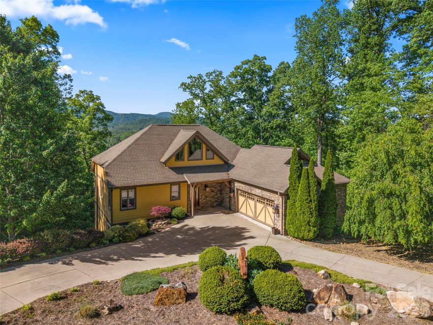 SStunning luxury A-frame retreat in sought-after Lake Lure offering breathtaking year-round mountain views and exceptional craftsmanship throughout. This 3-bedroom, 3.5-bath custom home blends timeless elegance with modern mountain living, featuring rich Brazilian cherry wood floors, soaring cathedral ceilings, and an open-concept layout filled with natural light. The dramatic great room showcases the signature A-frame architecture with expansive windows that perfectly frame the surrounding mountain views.

Designed for both everyday comfort and upscale entertaining, the chef’s kitchen flows seamlessly into spacious living and dining areas, while the private movie room creates the ultimate in-home theater experience. A beautifully appointed wine cellar adds a refined touch for collectors and entertainers alike.

Step outside to your outdoor kitchen and enjoy elevated mountain living at its finest—perfect for hosting guests or relaxing in the peaceful natural setting. Each bedroom offers privacy and comfort, with en-suite style living and thoughtfully designed spaces throughout.

Residents also enjoy access to an exceptional community clubhouse featuring a resort-style pool, fully equipped fitness center, and a full kitchen and entertaining space ideal for private gatherings, celebrations, and hosting guests.

This exceptional property delivers luxury, privacy, exclusive amenities, and the unmatched charm of mountain living in one of Western North Carolina’s most desirable destinations. A rare opportunity to own a true showpiece in Lake Lure.