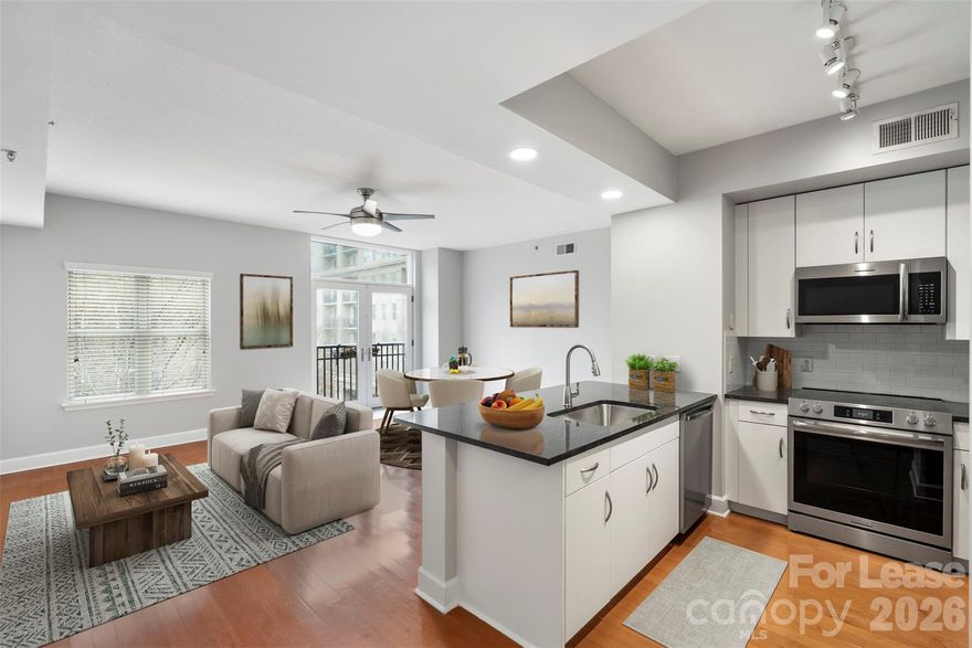Newly renovated split bedroom floor plan in sought after Latta Pavilion in Dilworth.  All new appliances, new paint, new kitchen cabinets & counters & new Master shower.  Home looks amazing!  Building is concrete & steel construction & very quiet.  Lots of natural light from southern facing condo.  Walkable to restaurants, shops, grocery stores, Atrium Hospital, light rail & Freedom Park.  Building and parking are both secure entrance.