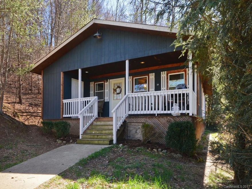 Perfect for first time home buyer or vacation rental.  Precious cabin with ship lap walls, hardwood floors, wood stove, tile floors in bathrooms, storage building.  Covered side porch for grilling and enjoying mountain views. Covered front porch for relaxing in your rocking chair.
