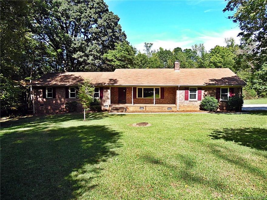 Spacious ranch living awaits in this 3 BR/2 BA home located on nearly 3 private acres w/easy access to nearby conveniences & I-77! Enjoy your wooded surroundings from the rocking chair front porch or expansive deck. Huge rec room, large bedrooms, kitchen w/plenty of cabinet space & cozy den w/brick wood burning fireplace. Country quiet without sacrificing city conveniences! Strongly encouraged that offers include proof of funds/pre-approval & is required for seller's final acceptance.