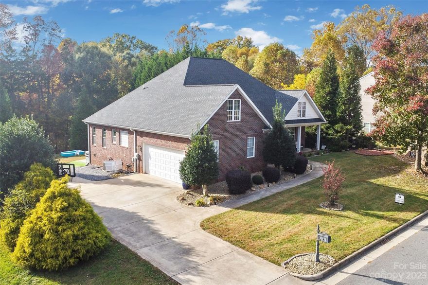 Nestled in highly desired Deer Creek, this brick home sits on over 1/2 acre, offering both privacy & ample outdoor space. As you step inside, the gleaming wood floors catch your eye, extending throughout the main level & perfectly tying together the open floor plan. The family room boasts a vaulted ceiling, adding a touch of spaciousness. The kitchen showcases wood cabinets, complemented by high end SS appliances & granite countertops. The oversized primary bedroom serves as a spacious retreat, leading to an ensuite bathroom adorned with tile floors. This bathroom boasts a dual vanity, a luxurious tub, a separate shower & is completed with a WIC. On the main level, you'll also find the dining room, sunroom, laundry room, 2 bedrooms & a full bath. Upstairs, you're greeted with multiple living areas, added storage & 2 bedrooms. Outside, a back deck opens up to a spacious backyard offering privacy as it's bordered by woods.  Schedule your tour today!