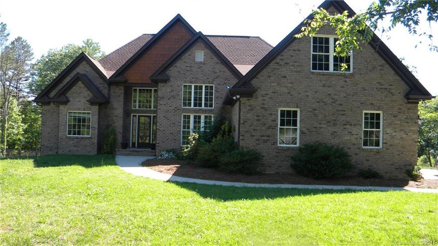 Superb all brick home with room to expand.  Unfinished walk-up attic space perfect for extra bedrooms, rec room, and bath.  Unfinished basement wired, only needs finishing touches, plumbed for a bathroom.  All this with 3.50 acres overlooking a lovely pond, fenced in yard.  Open and airy with a split bedroom plan for privacy, gas fireplace, lovely hardwood floors, large island in the kitchen. wonderful screened in porch with large deck attached.  Basement w/garage space or workshop.  Great Home!