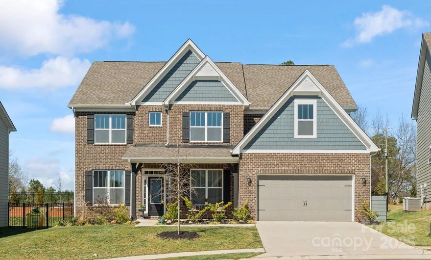 PRICE IMPROVED! Beautiful with stunning open plan on a desirable cul-de-sac in Avondale! 5 large bedrooms (with ensuite on main), 4 full baths & large Bonus with closet (6th bedroom). Elegance with tasteful neutrals, generous hardwoods. Smart & eco-friendly home (smart home hub, electric car charger pre-wiring and a tankless water heater). Main floor layout is perfect for entertaining with the gourmet kitchen featuring a gas cooktop & vented hood, stainless steel appliances, and a butler’s pantry. Great room with a gas fireplace is flanked by custom built-ins.  Home office, formal dining room, and drop zone with large laundry room & storage completing the first floor. Enjoy outdoors on covered porch or a paver patio with sitting wall and firepit in privacy of fenced yard with tall evergreens. Resort-style amenities include a clubhouse, fitness center, pool, playground, bocce and pickleball. Minutes from Ballantyne, with top-tier shopping, dining, and entertainment but low SC taxes!