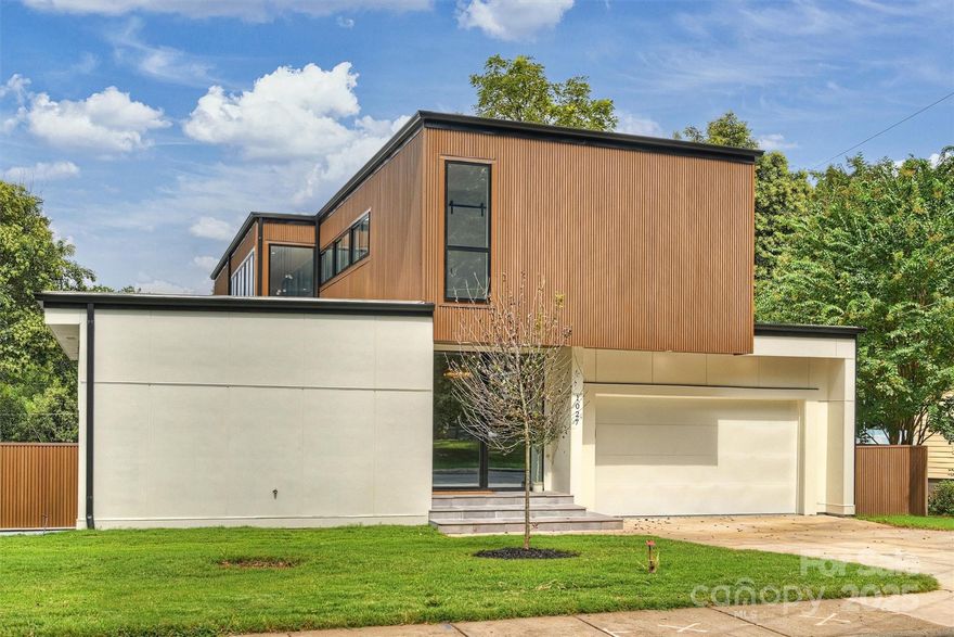 This beautiful new construction contemporary home in Villa Heights offers 4 bedrooms, 4.5 bathrooms, and 3,841 sq ft of thoughtfully designed living space. The open floor plan features European oak flooring, travertine kitchen and bath countertops, a large waterfall kitchen island & Thor Kitchen appliances. Living room includes a built-in entertainment center & two bi-fold doors that expand almost the entire width of the living room walls, allowing you to create a seamless indoor-outdoor flow to the expansive paver and turf patio. The primary suite has its on private bi-fold door, a garden tub and walk-in closet. The upstairs living area includes a built-in work space and entertainment center & each second floor bedroom offers its own walk-in closet and bathroom. The fenced backyard offers added privacy & there has a inground irrigation system in the front & back yard. Located just minutes from NoDa, Plaza Midwood, & Uptown. Don’t miss out on your opportunity to own this amazing home!