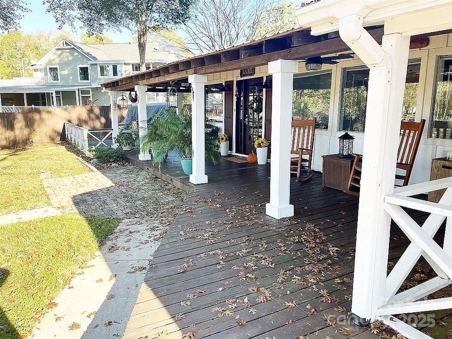 Welcoming open concept interior includes a large designer kitchen with quartz countertops, Cafe appliances, oversized island, coffee area with pantry and additional seating area. Adjacent living room has a real wood burning fireplace with craft stove insert. Primary bedroom has 2 closets. Primary bath with claw foot tub, two sinks and a 5 foot walk in tile shower. Second bedroom has built in bed with trundle pull out and closet. Office space looks out to vacation like lake view. Two detached buildings with separate entrances. Home has 100 feet of lake frontage with beautiful deep water dock, covered deck and a 16 x 20 floating dock. Landscape areas for gardening and entertain family and friends. Above ground pool.