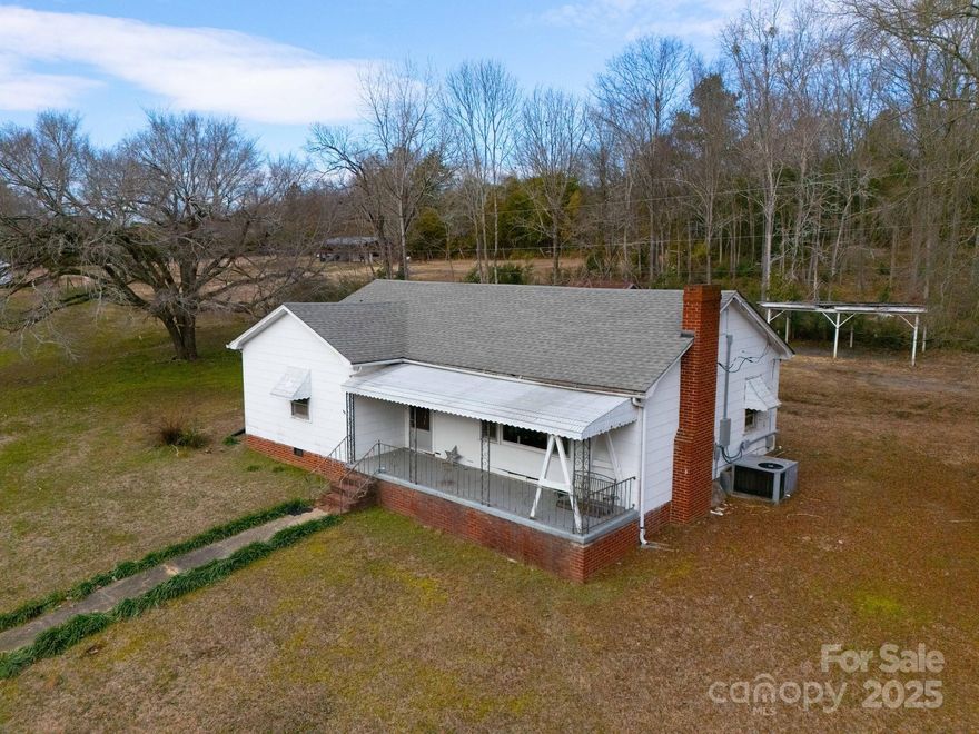 Investor Alert! This charming two-bedroom, one-bath bungalow, featuring original hardwood floors and stunning archways, is situated on a spacious two-acre lot just minutes from downtown Norwood. The property offers excellent potential for an additional building site or room for livestock. A small storage shed and carport are located in the backyard for added convenience. Norwood and Stanly County are known for their proximity to Lake Tillery and Morrow Mountain State Park, offering abundant outdoor recreation and a peaceful, slower-paced lifestyle—perfect for escaping the hustle and bustle of city life. Don't miss out on this unique opportunity!