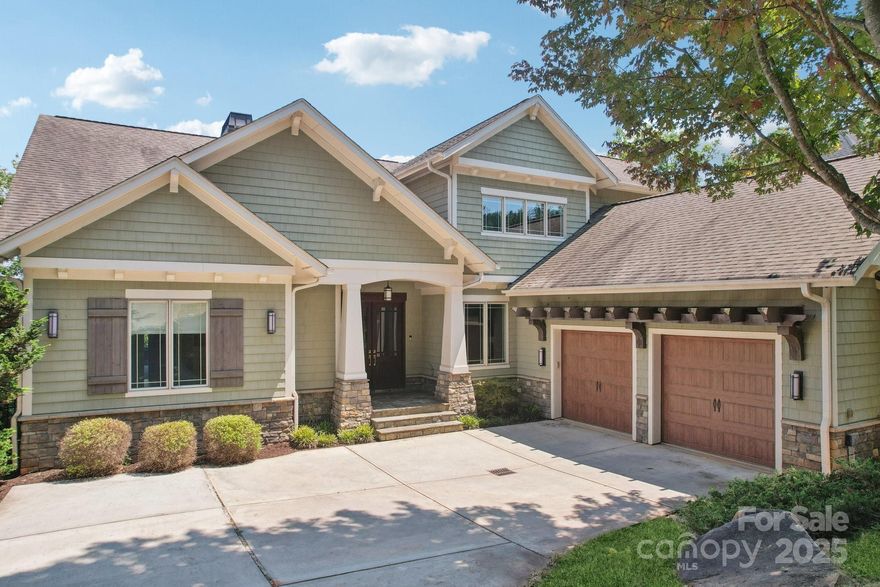 Main channel waterfront in gated Reflection Pointe with year-round views and a deep-water covered dock with lift. This 3-level home offers open living, walnut hardwood floors, and stunning views from nearly every room. The main level features a spacious kitchen with large island, walk-in pantry, stone fireplace, and a screened porch with outdoor fireplace. Main-level primary suite includes spa bath with soaking tub, zero entry shower, split vanities, and large closet. Upstairs offers 2 bedrooms each private bath, and a loft. The walkout basement has 14’ ceilings, a kitchenette/bar, fireplace, 2 bedrooms, fitness room, and flex space. Step outside to a turfed backyard, fire pit, and patio just steps from the water. Enjoy community pool, clubhouse, marina, tennis courts, walking trails, and boat storage—just minutes from charming downtown Belmont.