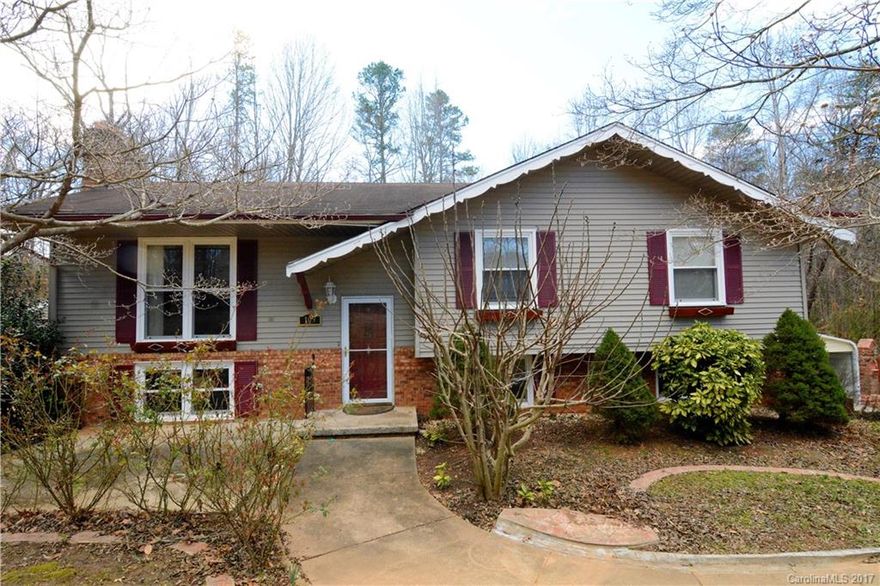 Lake Norman access;boat ramp,pier&dock at end of street. Enjoy community shelter&picnic area. 3bd/3ba home, fireplaces on main level & lower level. Beautiful walnut hardwood floors. Enjoy sitting on back deck in private back yard w/storage building. Home features dual HVAC unit. Lower level offers spacious rec rm great for entertaining & full ba. Easy travel to Statesville, Hickory & Mooresville. NO HOA'S. Lg wired building/she/shed or man cave/workshop. Great property. Home needs some TLC.