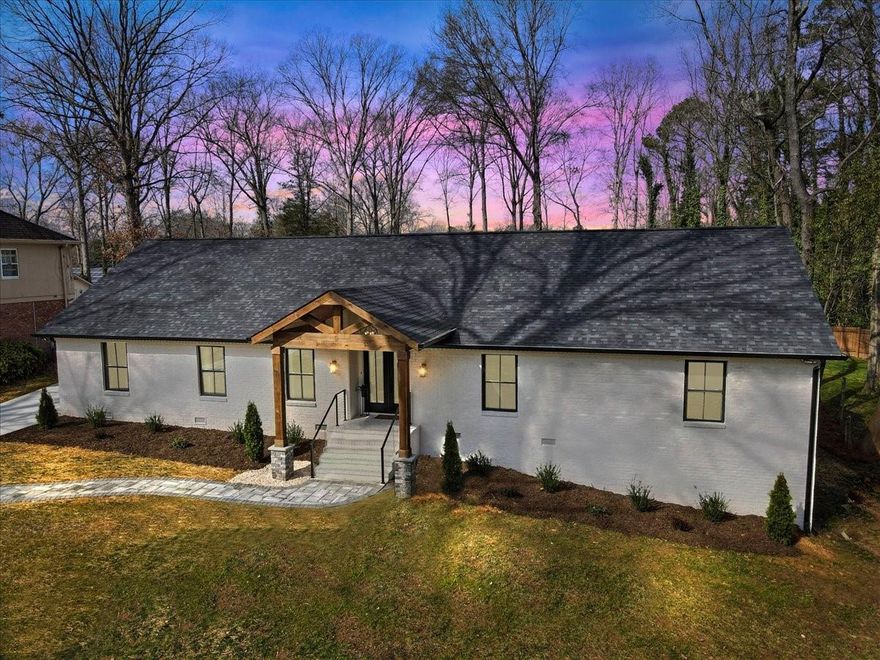 Welcome to this modern brick ranch thoroughly renovated with open floor plan and luxurious primary suite that shows like new! The spacious all new dream kitchen has white Quartz counters, huge waterfall island, commercial grade 48" gas range with double oven, wine cooler, stainless farm sink, large walk in pantry and lots of cabinet space. Opens to living room with gas fireplace. Primary includes two closets with custom built-ins, large bath with tiled shower and sep tub. Two bedrooms with a jack and jill across the hall and a fourth bedroom/office sits next to a third full bathroom. Glass doors open to outdoor kitchen including grill, fridge and sink under a pergola as well as a fire pit. Detached 2 car garage has finished heated/cooled space above perfect for an office, workout room, studio or apartment. Water and sewer are available to add bath/kitchen. Large lot with space for pool. A short commute to uptown, southpark & airport. Great schools, restaurants & shops nearby. Turn Key.