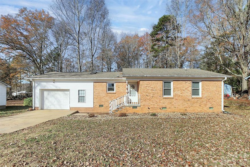 A very nice and well kept 3 bed, 2 bath home that had a recent makeover. Flooring, kitchen cabinets, countertops and appliances, bathrooms and bedrooms all had attention given to them in 2021. Windows and HVAC were also replaced then. Stainless front appliances and fresh paint inside this home that has been lightly lived in and offers a large lot, quiet street and attached garage with separate utility area and overhead storage. Garage area has great depth, as it's over-sized and has a side door for entrance. Backyard has great privacy especially when trees are back in bloom. Come see for yourself!